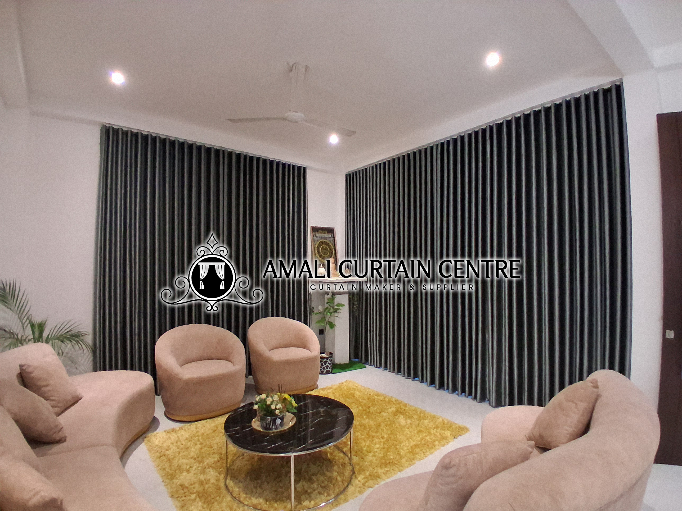 Sheer drapes installed in a bedroom by Amali Curtain Center